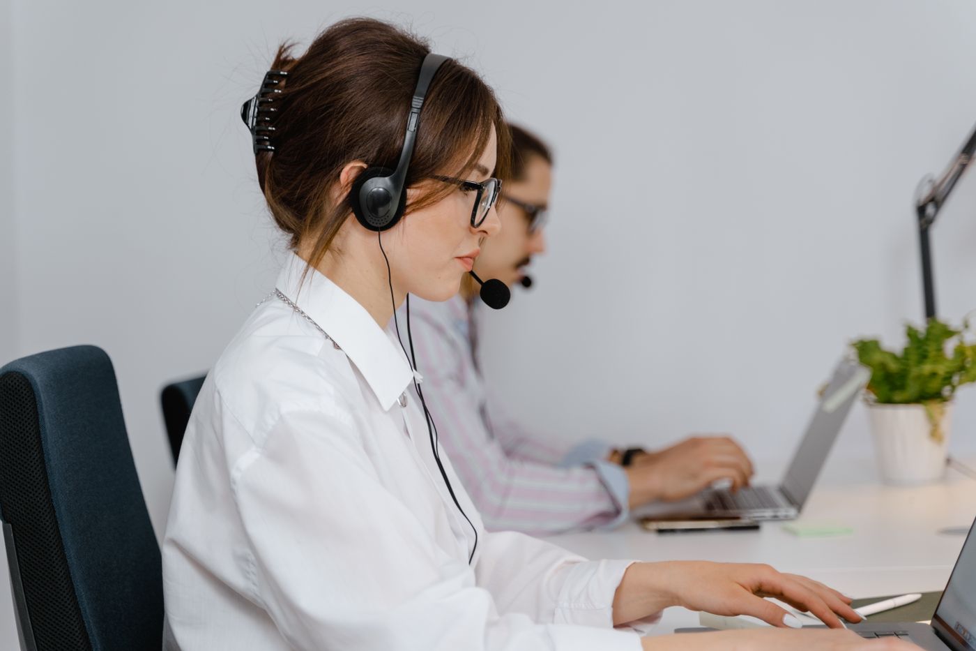 Offshore call centre services team wearing headsets handling customer calls